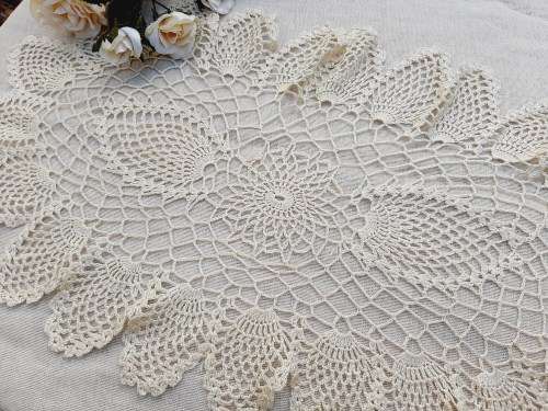 Large, oval, cream crochet doilie 70 x 35 cm