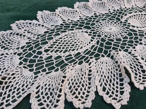 Large, oval, cream crochet doilie 70 x 35 cm