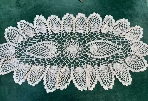 Large, oval, cream crochet doilie 70 x 35 cm