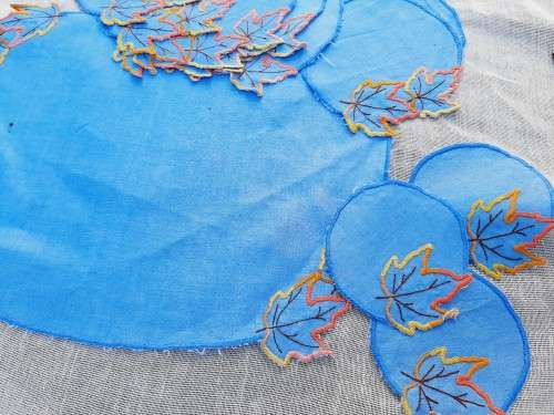 Set of 13  blue embroidered mats