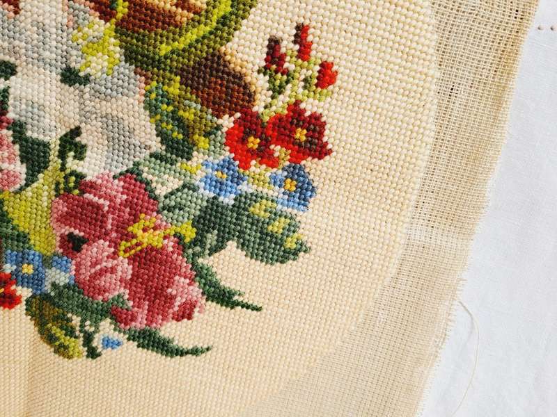 Completed tapestry of a basket of flowers - 35cm diameter