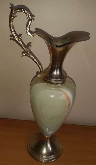 Natural Onyx Italian vase with brass coloured top handle and base has small crack in brass top piece