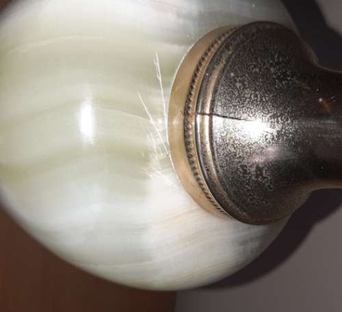 Natural Onyx Italian vase with brass coloured top handle and base has small crack in brass top piece