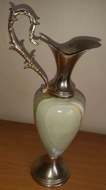 Natural Onyx Italian vase with brass coloured top handle and base has small crack in brass top piece