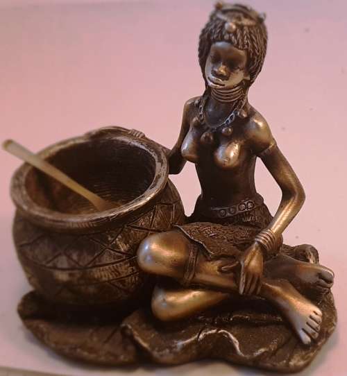 Bronze colour African lady with cooking pot and spoon