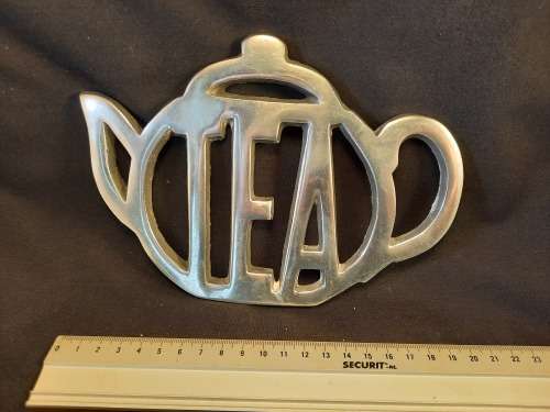 Stand for teapot silver coloured metal Tea motive size length 19 cm width 14 cm