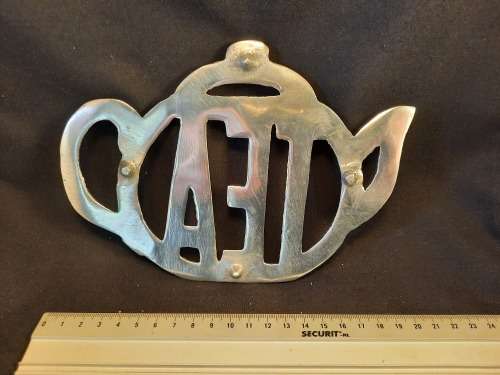 Stand for teapot silver coloured metal Tea motive size length 19 cm width 14 cm