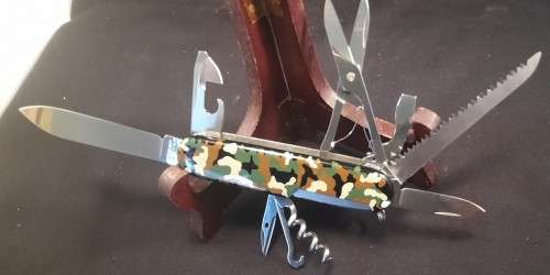 Victorinox Swiss Army knife (Huntsman) with one camo scale and one Black scale