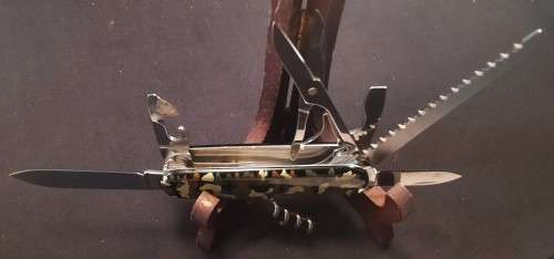 Victorinox Swiss Army knife (Huntsman) with one camo scale and one Black scale