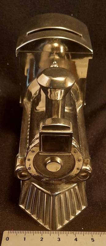 silver coloured Metal coin Bank Steam train money box