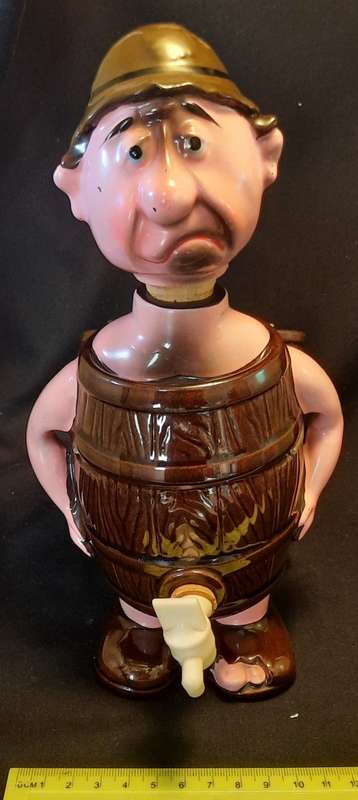 Decanter Man in Barrel with four small mugs on his Back
