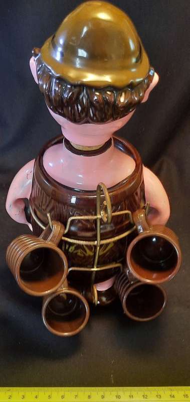 Decanter Man in Barrel with four small mugs on his Back
