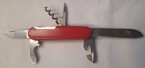 Vintage Elinox -Spartan  Swiss Army Knife With Red Scales Main blade has been reshaped on the tip