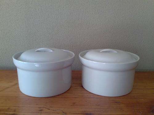 Two ceramic round deep serving bowls with lids