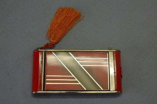A VERY UNUSUAL RED LADIES COMPACT WITH BUILT IN LIPSTICK, CALLING CARD AND CIGARETTE HOLDER & MORE