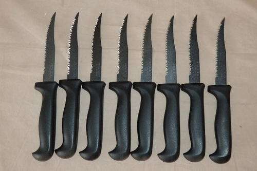 AN AWESOME SET OF 8 ORIGINAL NIKKEI STEAK KNIFE WITH THE TRADITIONAL TEFLON COATED BLACK BLADES