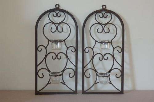 TWO STUNNING METAL WALL CANDLE HOLDERS WITH GLASS CANDLE CUPS AND GORGEOUS DETAILING bid/stand