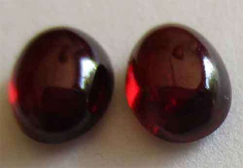 7.00 x 5.00mm Oval  Cab. Garnets , 2 pieces-T.W. 2.21 ct [price for both]