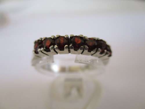 925 Sterling Silver and Genuine Garnets Eternity Ring.
