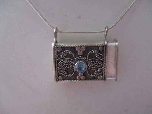 925 Sterling Silver and Bllue Topaz `Purse`/ Pendant on Strling Chain .