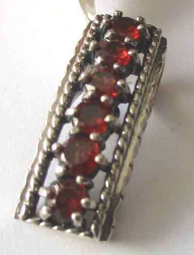 925 Sterling Silver and Garnets Pendant .