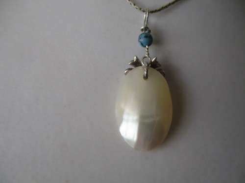 925 Sterling Silver Shell and Genuine Turquoise Pendant.
