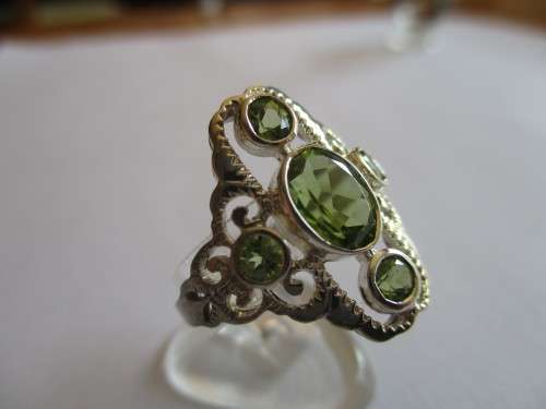 925 Sterling Silver and Peridots Ring.