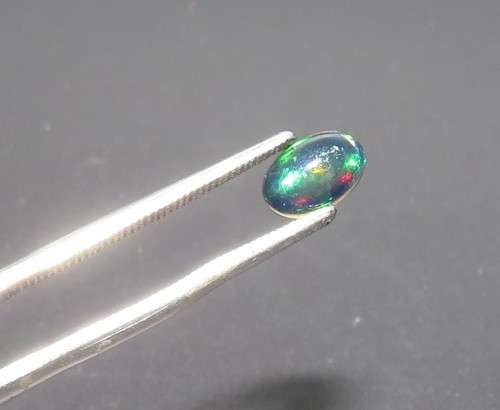2.44ct. Oval Cab cut 6.00x 4.00 mm Multi Color Play Black Opals