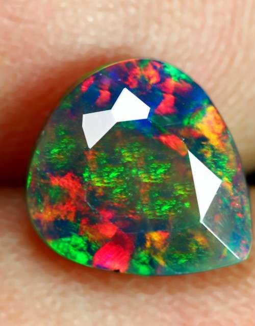 0.95 ct . Black Fire Opal Pear Faceted cut 8.00 x 7.00mm