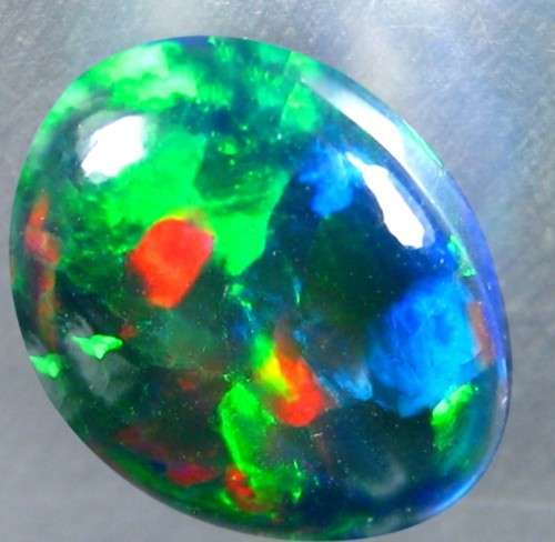 Black Opal 4.21Cts. Oval Cab. cut  14 x 10 mm Shimmering Multicolor Natural Solid Black Opal