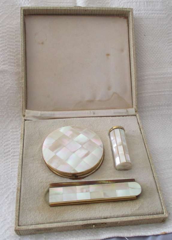 Vintage gold tone and mother of pearl powder compact, lipstick holder & comb in original box