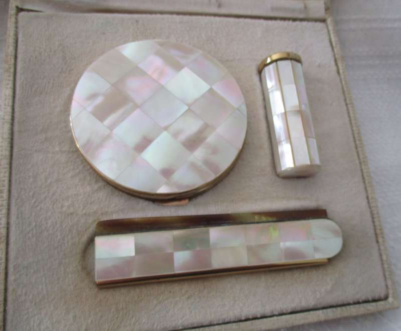Vintage gold tone and mother of pearl powder compact, lipstick holder & comb in original box