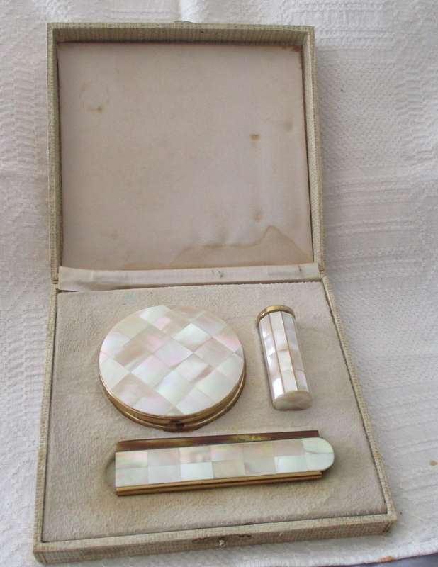 Vintage gold tone and mother of pearl powder compact, lipstick holder & comb in original box