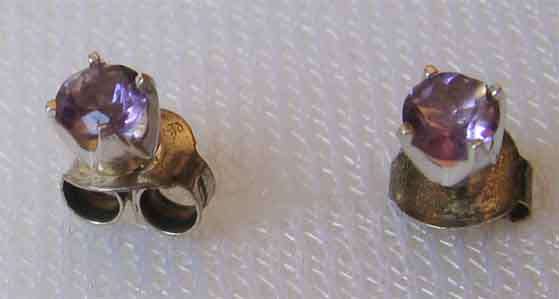 A pair of   Sterling Silver and Genuine Amethysts Stud/  Earrings.