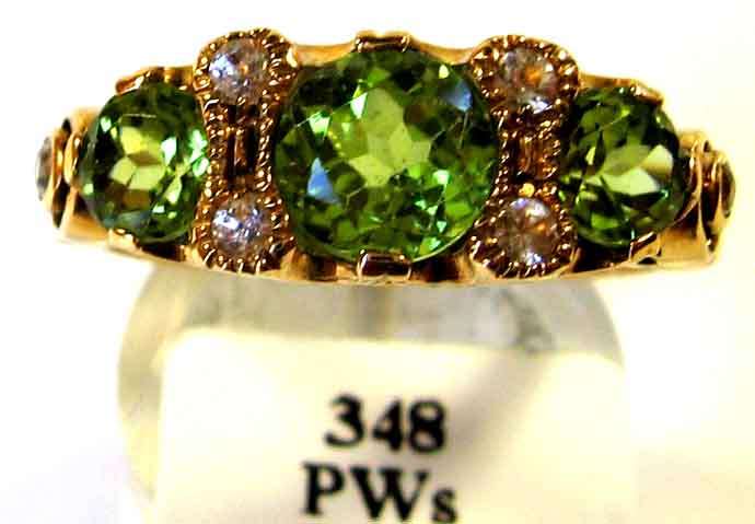 Exquisite , Genuine Peridots and White Sapphires in 9K Gold Ring.
