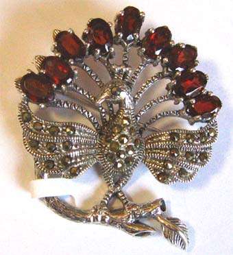 925 Peacock Brooch beautifully encrusted with Garnets and Marcasite.