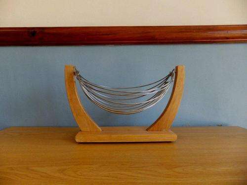 Unusual swinging fruit basket - stainless steel hammock shaped basket on a wooden stand