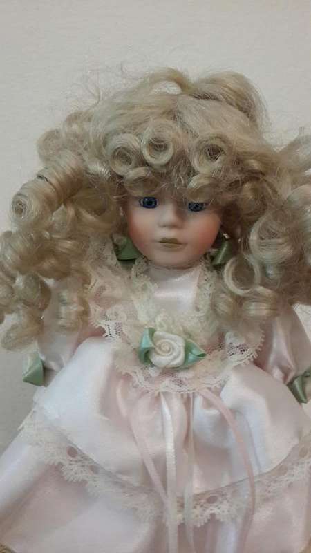 Beautiful Porcelain Doll on stand - curly blonde cherub! Studs on her shoes say Jeun Bang