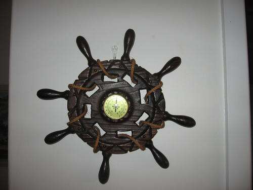 Thermometer set in a wooden ships wheel with rope detail!  Collectable!