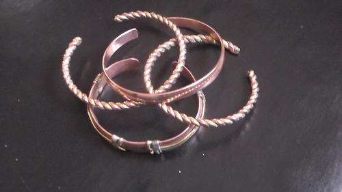 4 X assorted brass and copper bangles