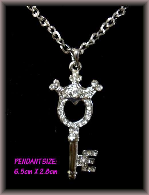 KEY PENDANT WITH DIAMANTE'S ON A SILVER NECKLACE