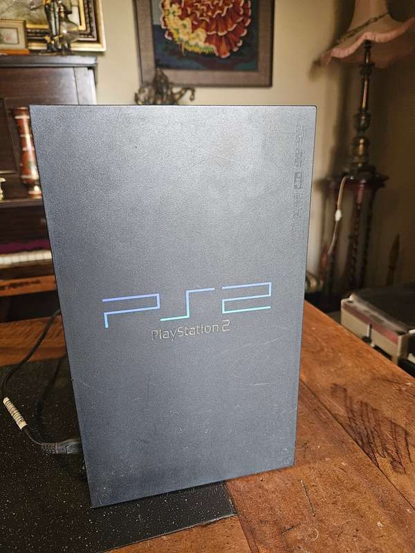 Sony PlayStation 2 with Expansion Box + a Steering Wheel