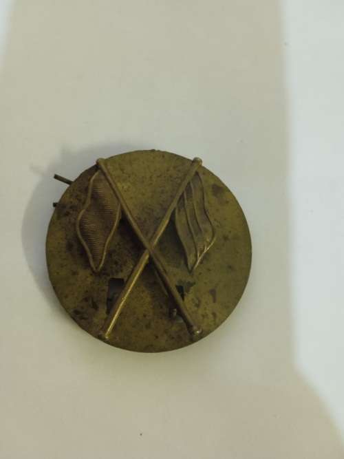 Signals badge on backing plate
