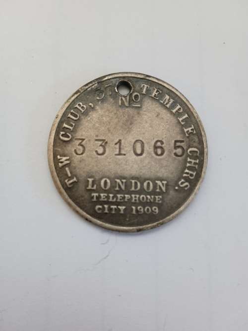 Tail Wagger club medallion