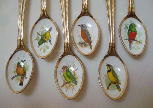 SET OF TWELVE VINTAGE GOLD-PLATED STAINLESS STEEL & ENAMEL TEASPOONS OF SOUTH AFRICAN BIRDS