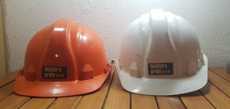 PAIR OF UNUSED BUILDERS PRIDE SAFETY HELMET.