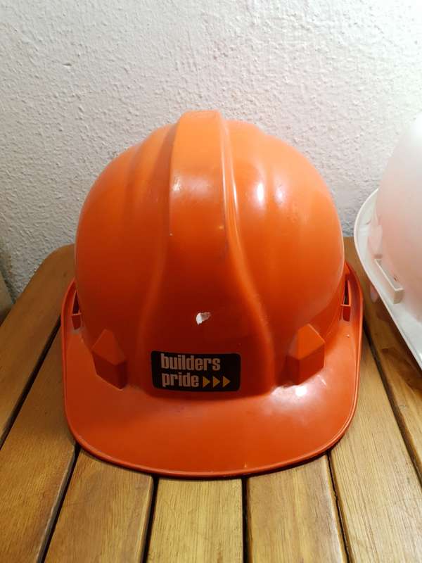PAIR OF UNUSED BUILDERS PRIDE SAFETY HELMET.