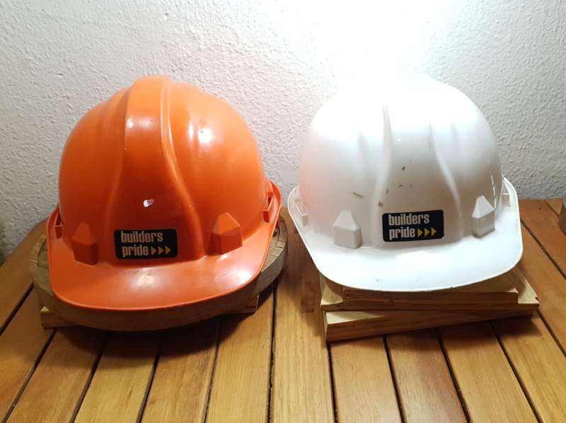 PAIR OF UNUSED BUILDERS PRIDE SAFETY HELMET.