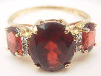 10KT SOLID GOLD WITH 3.9 CARRATS OF GENIUNE GARNETS - IN STOCK