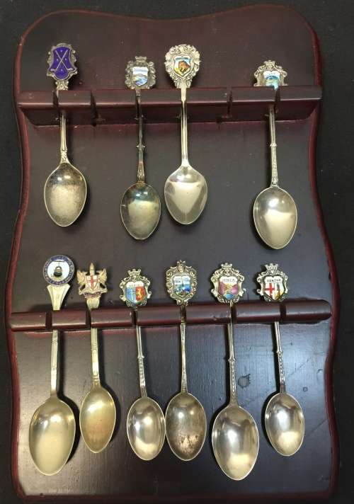 Nice wooden house spoon holder with collectable spoons. All For 1 Bid.